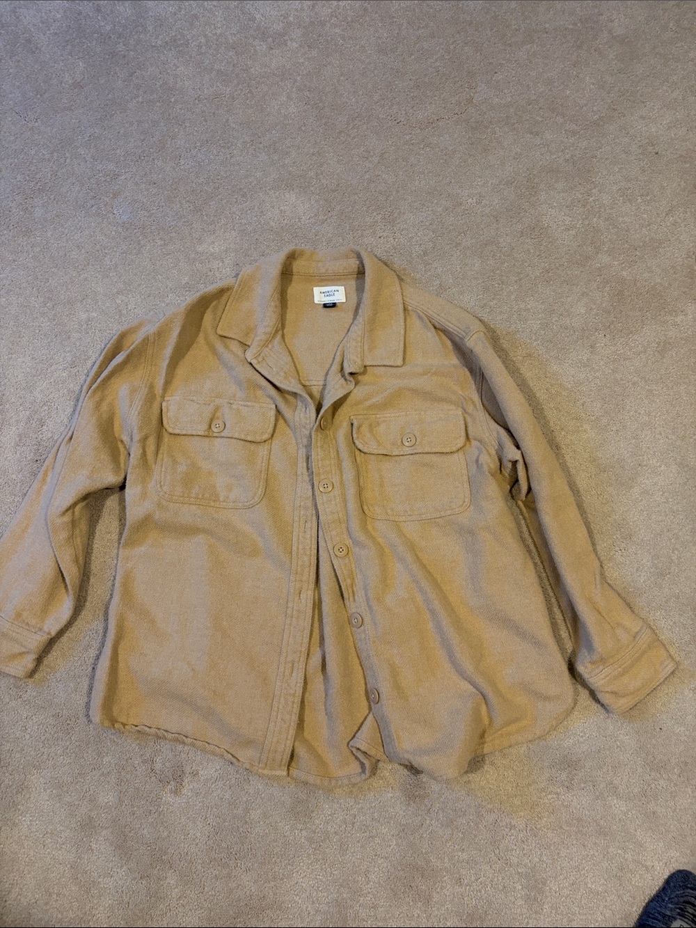 American Eagle tan flannel button-up shacket